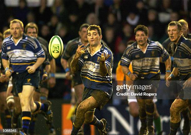 Nathan Spooner of Leinster passes the ball on during the Heineken Cup quarter-final match against Leicester Tigers played at Welford Road, in...