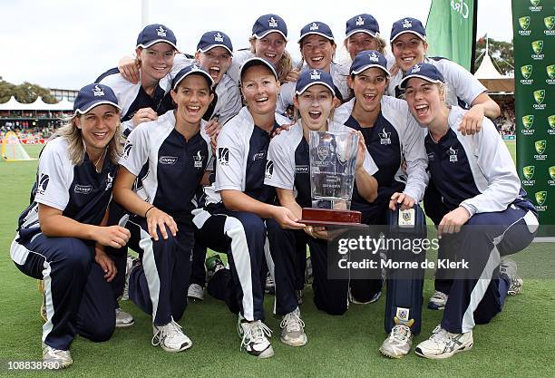 Players of the Spirit celebrate with the cup after the WNCL Twenty20 Final match between the New South Wales Breakers and the Victorian Spirit at...