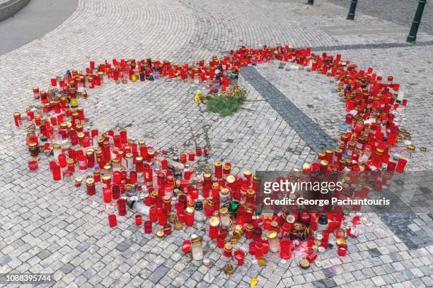 red candles laid in heart shape - mourning candles stock pictures, royalty-free photos & images
