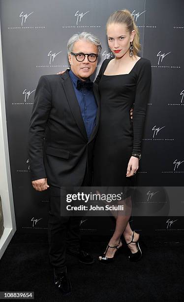 Designer Giuseppe Zanotti and Cody Horn attend the Giuseppe Zanotti Design Beverly Hills Store Opening cocktail reception held on February 4, 2011 in...