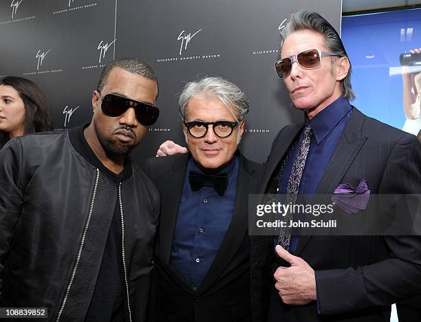 Kanye West, Designer Giuseppe Zanotti and Tattoo artist Mark Mahoney attend the Giuseppe Zanotti Design Beverly Hills Store Opening cocktail...