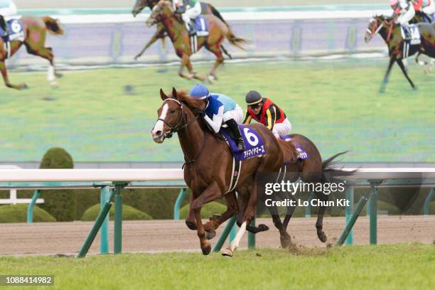 Jockey Mirco Demuro riding Admire Mars wins the Race 11 Asahi Hai Futurity Stakes at Hanshin Racecourse on December 16, 2018 in Takarazuka, Japan.