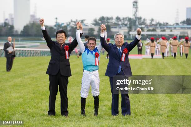 Jockey Mirco Demuro, trainer Yasuo Tomomichi and owner Riichi Kondo celebrate after Admire Mars winning the Race 11 Asahi Hai Futurity Stakes at...