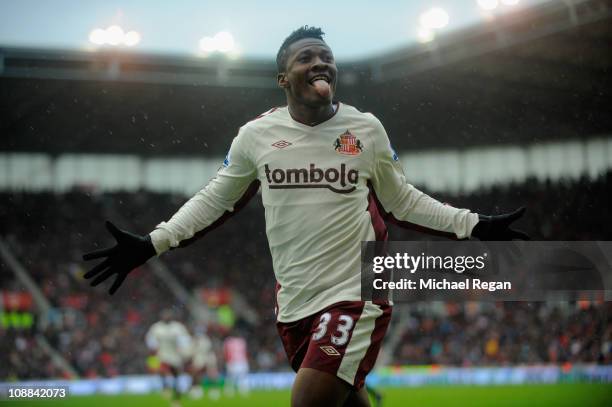 Asamoah Gyan of Sunderland celebrates scoring to make it 2-1 during the Barclays Premier League match between Stoke City and Sunderland at the...