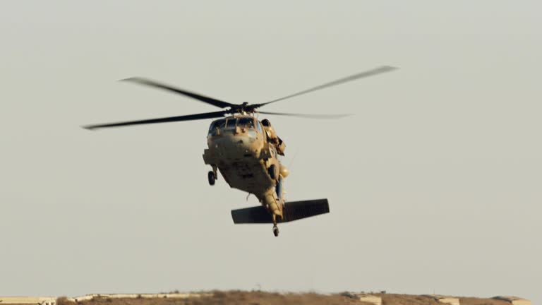 https://media.gettyimages.com/id/1088426564/video/military-blackhawk-helicopter-during-a-rescue-mission-in-a-base.jpg?b=1&s=640x640&k=20&c=Rk_zpq-RtGE0AfTQvo97HS43KwKhbxzA0BloDeKq8hM=