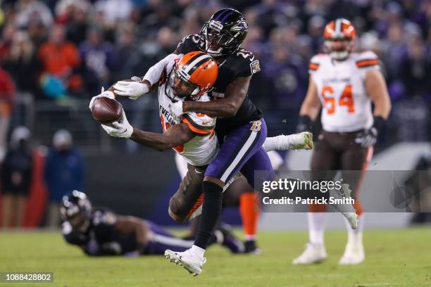 Wide Receiver Jarvis Landry of the Cleveland Browns is tackled after a reception by cornerback Tavon Young of the Baltimore Ravens in the fourth...