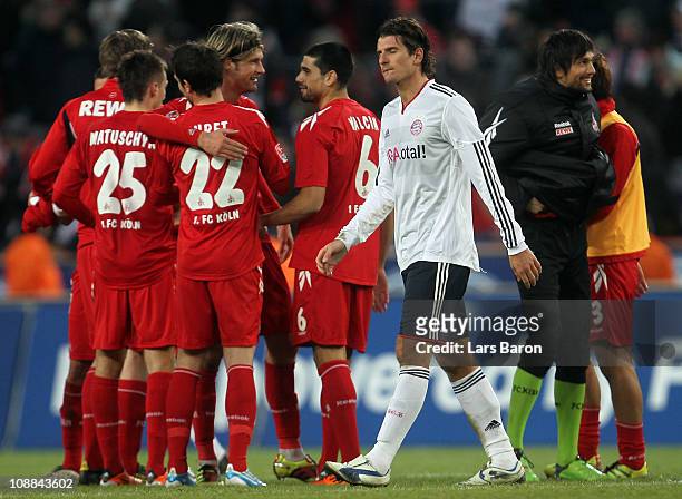 Mario Gomez of Muenchen looks dejected after loosing the Bundesliga match between 1. FC Koeln and FC Bayern Muenchen at RheinEnergieStadion on...