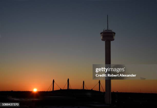 The sun rises behind the Tower of the Americas in San Antonio, Texas, a 750-foot observation tower-restaurant built for the 1968 World's Fair,...