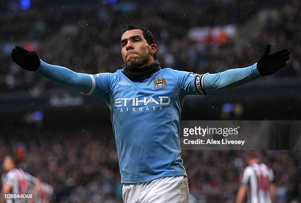 Carlos Tevez of Manchester City celebrates after scoring his third goal during the Barclays Premier League match between Manchester City and West...