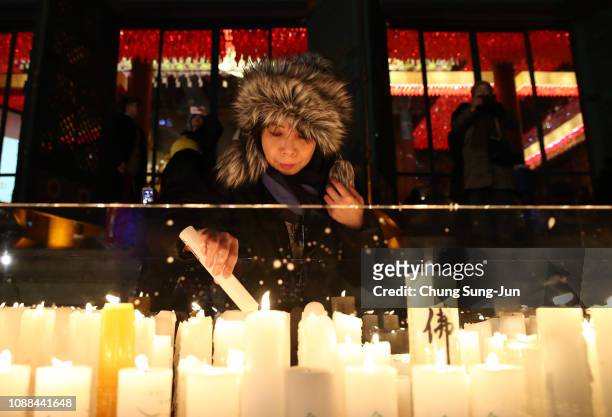 Buddhists light candles during New Year celebrations at Jogyesa Buddhist temple on January 1, 2019 in Seoul, South Korea.