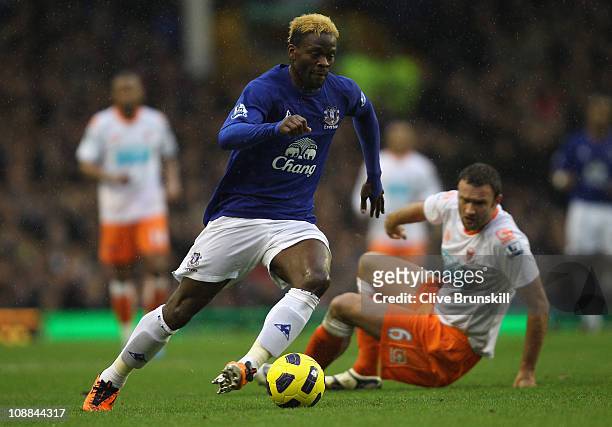 Louis Saha of Everton moves away from Ian Evatt of Blackpool during the Barclays Premier League match between Everton and Blackpool at Goodison Park...