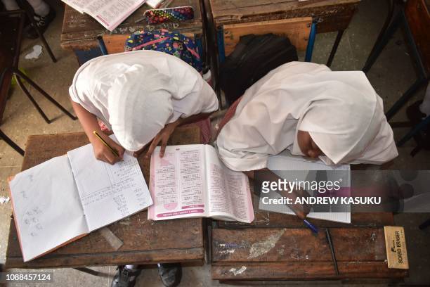 Muslim pupils wearing hijabs study at the Ganjoni Primary School in Mombasa, coastal Kenya, on January 25, 2019. - Kenyan Supreme Court on January 24...