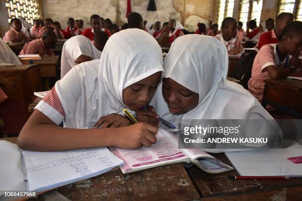 Muslim pupils wearing hijabs study at the Ganjoni Primary School in Mombasa, coastal Kenya, on January 25, 2019. - Kenyan Supreme Court on January 24...