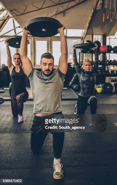 personal weight training - personal trainer stock pictures, royalty-free photos & images