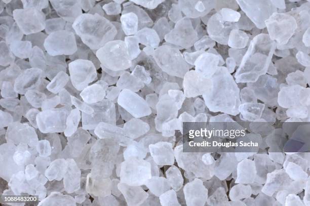 crystal rock salt for road de-icing - rock salt stockfoto's en -beelden