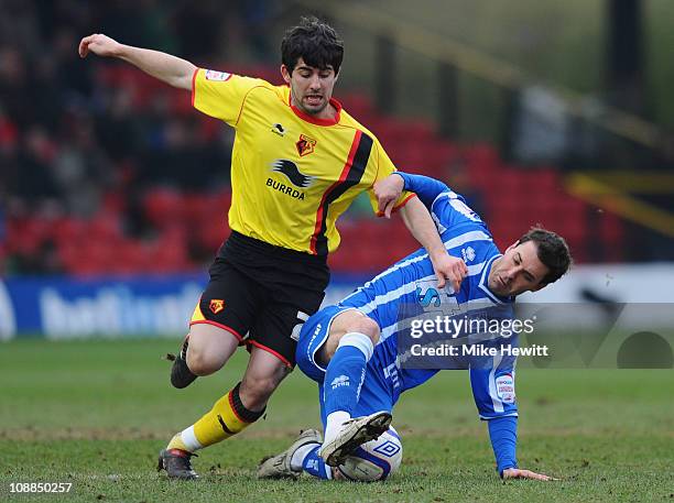 Piero Mingoia of Watford is challenged by Matt Sparrow of Brighton during the FA Cup Sponsored by E.ON 4th Round match between Watford and Brighton &...