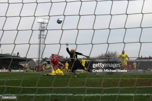 Matthew Tubbs of Crawley Town scores the opening goal during the FA Cup sponsored by E.ON 4th round match between Torquay United and Crawley Town at...