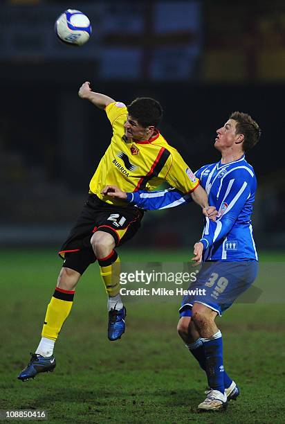 Rob Kiernan of Watford is challenged by Chris Wood of Brighton during the FA Cup Sponsored by E.ON 4th Round match between Watford and Brighton &...