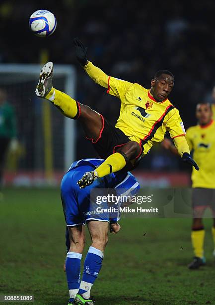 Lloyd Doyley of Watford flies over the top of Glenn Murray of Brighton during the FA Cup Sponsored by E.ON 4th Round match between Watford and...