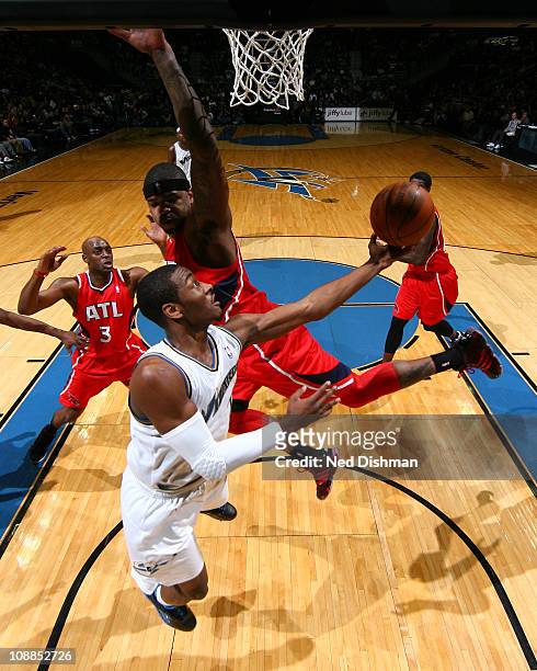 John Wall of the Washington Wizards shoots against Marvin Williams of the Atlanta Hawks on February 5, 2011 at the Verizon Center in Washington, DC....