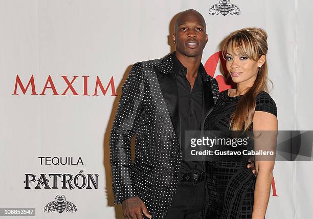 Player Chad Ochocinco Johnson and Evelyn Lozada attend the Maxim Party Powered by Motorola Xoom at Centennial Hall at Fair Park on February 5, 2011...