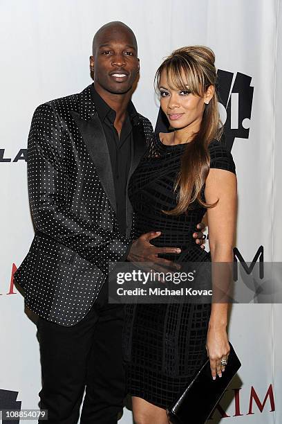 Player Chad Ochocinco Johnson and Evelyn Lozada poses with AOL at the Maxim Party Powered by Motorola Xoom at Centennial Hall at Fair Park on...