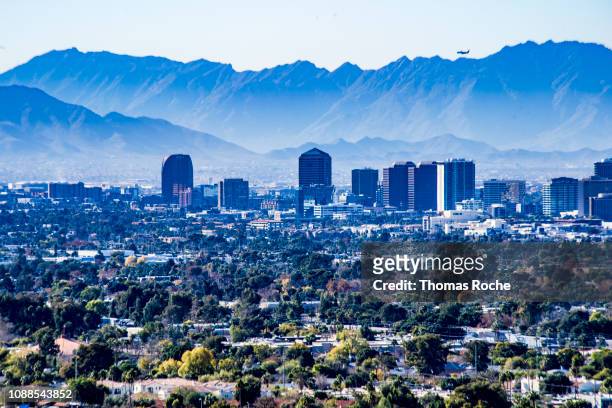 phoenix skyline and the mountains beyond - phoenix arizona stock pictures, royalty-free photos & images