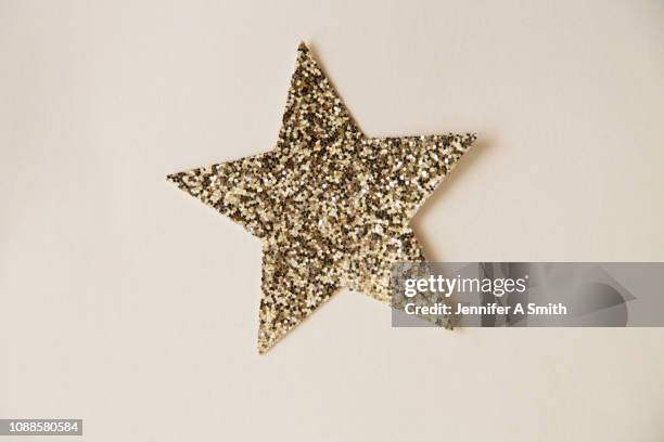 glitter star - glitter stars stock pictures, royalty-free photos & images