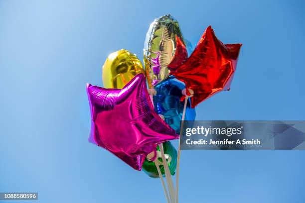 coloured balloons - helium balloon stock pictures, royalty-free photos & images