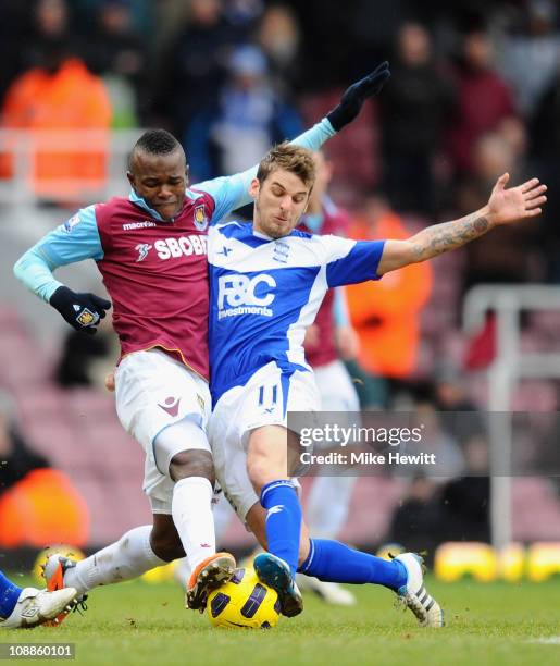 Victor Obinna of West Ham United and David Bentley of Birmingham City battle for the ball during the Barclays Premier League match between West Ham...