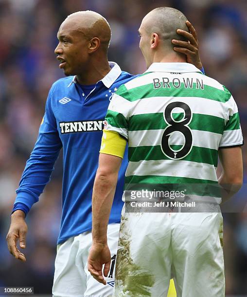El Hadji Diouf of Rangers and Scott Brown of Celtic react during the Scottish Cup 5th round match between Rangers and Celtic at Ibrox Stadium on...