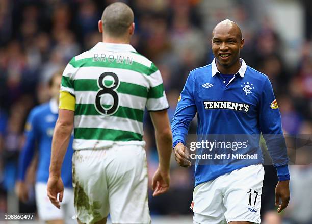 El Hadji Diouf of Rangers and Scott Brown of Celtic react during the Scottish Cup 5th round match between Rangers and Celtic at Ibrox Stadium on...