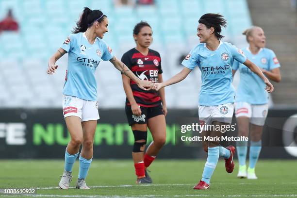 Adriana Jones of Melbourne City celebrates scoring a goal with team mate Yukari Kinga of Melbourne City during the round nine W-League match between...