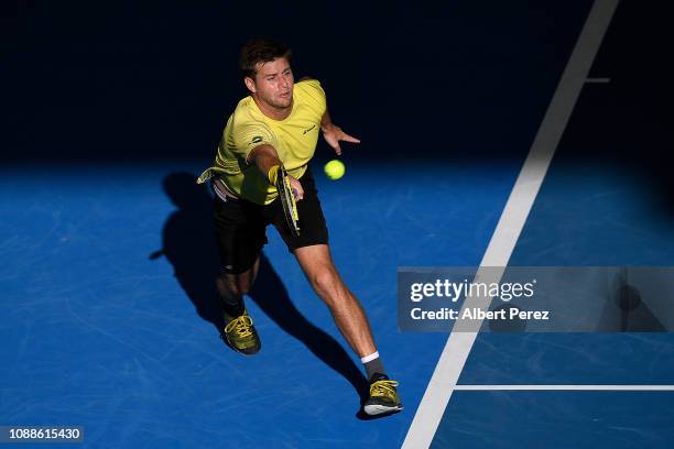 Ryan Harrison of USA plays a backhand in his match against Nick Kyrgios of Australia during day three of the 2019 Brisbane International at Pat...