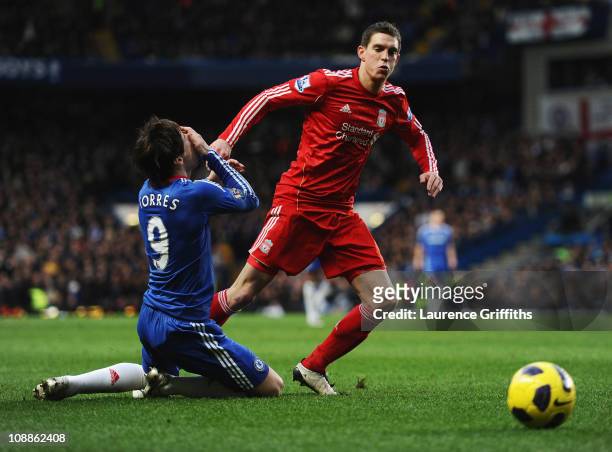 Fernando Torres of Chelsea holds his face after a is challenge by Daniel Agger of Liverpool during the Barclays Premier League match between Chelsea...