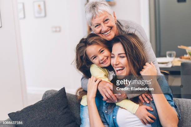 three generation women - granddaughter stock pictures, royalty-free photos & images