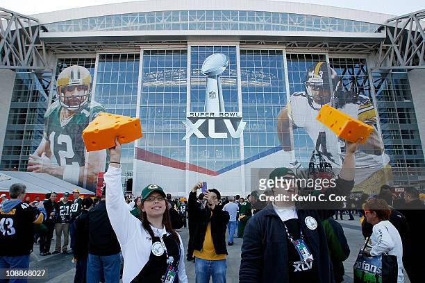 Vendors sell cheese head hats for Green Bay Packers fans before they play against the Pittsburgh Steelers in Super Bowl XLV at Cowboys Stadium on...
