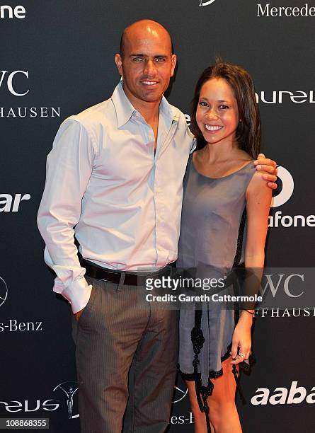 Surfer Kelly Slater of the United States and guest arrive for the Laureus Welcome Party as part of the 2011 Laureus World Sports Awards at Cipriani...
