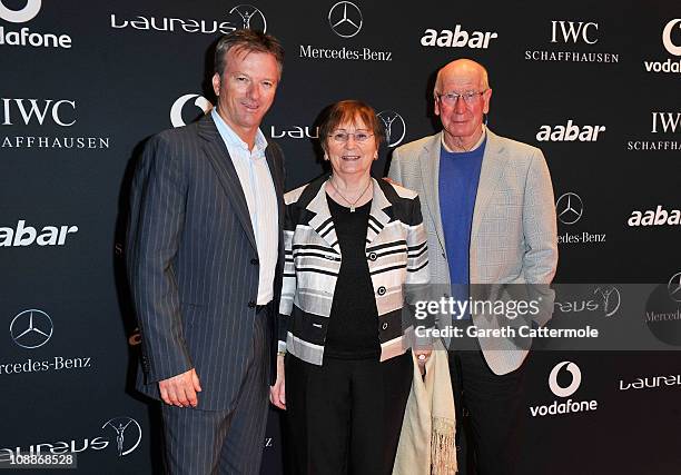 Academy member Sir Bobby Charlton and wife Lady Norma Charlton pose with former Australian cricket captain Steve Waugh at the Laureus Welcome Party...