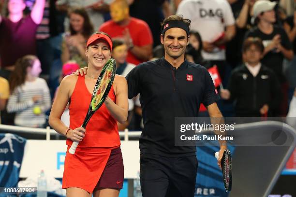 Belinda Bencic and Roger Federer of Switzerland celebrate winning the mixed doubles match against Serena Williams and Frances Tiafoe of the United...