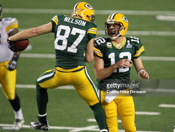 Jordy Nelson and Aaron Rodgers of the Green Bay Packers celebrate after a 29 yard touchdown pass against the Pittsburgh Steelers during Super Bowl...