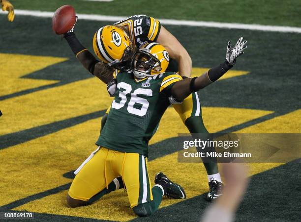 Nick Collins of the Green Bay Packers celebrates with Clay Matthews against the Pittsburgh Steelers during Super Bowl XLV at Cowboys Stadium on...