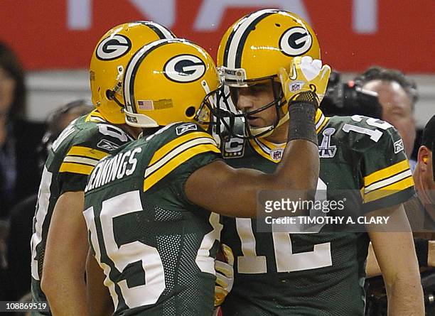 Greg Jennings of the Green Bay Packers is congratulated by quarterback Aaron Rodgers after scoring a touchdown during the NFL Super Bowl XLV football...