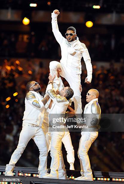 Usher performs with The Black Eyed Peas during the Bridgestone Super Bowl XLV Halftime Show at Dallas Cowboys Stadium on February 6, 2011 in...