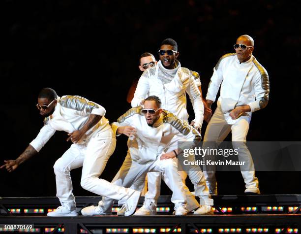 Usher performs with The Black Eyed Peas during the Bridgestone Super Bowl XLV Halftime Show at Dallas Cowboys Stadium on February 6, 2011 in...