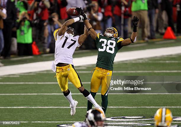 Tramon Williams of the Green Bay Packers breaks up a pass to Mike Wallace of the Pittsburgh Steelers late in the fourth quarter during Super Bowl XLV...