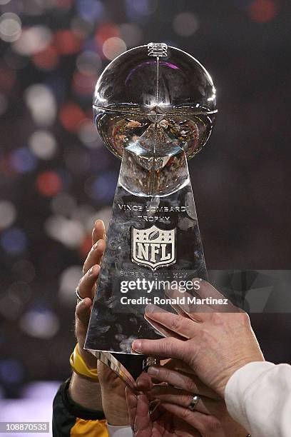 The Green Bay Packers hold up The Vince Lombardi Trophy after the defeating the Pittsburgh Steelers 31 to 25 in Super Bowl XLV at Cowboys Stadium on...