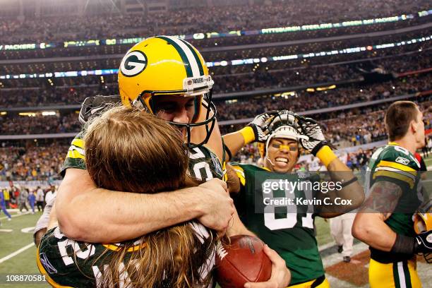 Aaron Rodgers hugs Clay Matthews of the Green Bay Packers as Andrew Quarless looks on after winning Super Bowl XLV 31-25 against the Pittsburgh...