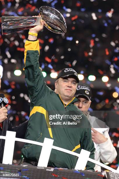 Head coach Mike McCarthy of the Green Bay Packers holds up the Vince Lombardi Trophy after winning Super Bowl XLV 31-25 against the Pittsburgh...