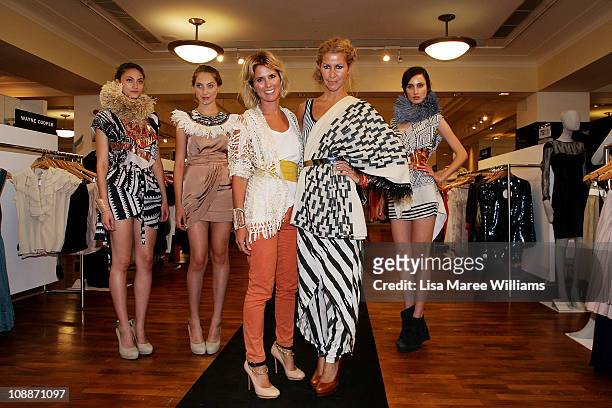 Sass & Bide co-founders Sarah-Jane Clarke and Heidi Middleton poses with models during a photo call announcing their new strategic partnership with...